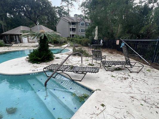 They never prepare for the storm by storing away the pool area furniture.