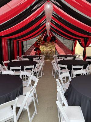 Draped tent, decoration, tables, black linen white resin chairs