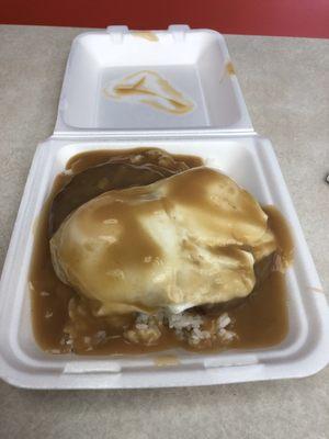 Loco Moco- 2 over easy eggs over two hamburger patties over a mountain of rice