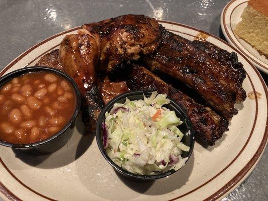 The "Finger Lickin" combo .... 3 tiny bad ribs, nothing special smoked chicken. 2 little tiny cups of beans and coleslaw.