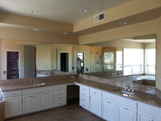 Mirrored walls with outlet coutouts