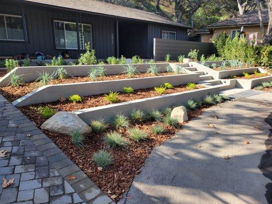 Frontyard landscaping and terracing with pour in place concrete walls