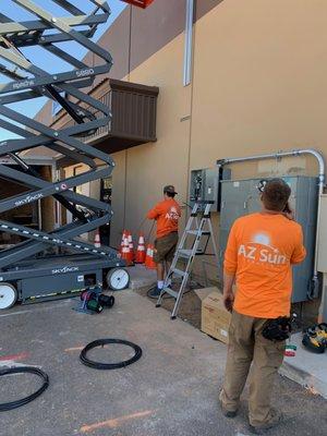 Some of our hard-working crew, wearing our branded shirts at a commercial job site