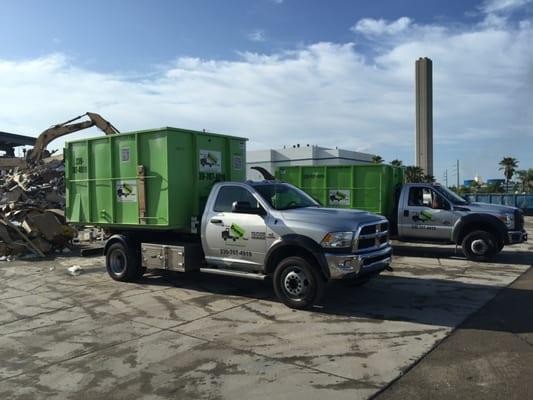 Both trucks meet at waste facility.