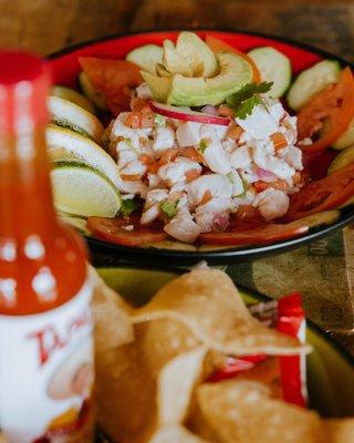 CEVICHE Chopped shrimp or mahi-mahi marinaded in lime juice and salt until cured. Mixed with tomato, jalapeño, cilantro, and cucumber.