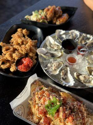 Crispy Calamari, Garlic Wings, poke nachos & oysters during Happy Hour 09.02.24