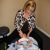 Dr. Ruth Nielson adjusting a pediatric patient