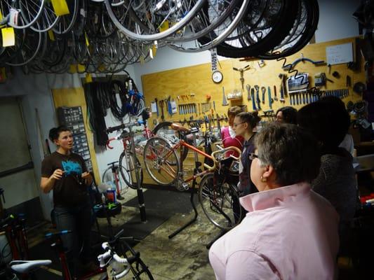 Local pro Hilary teaches a ladies bike maintenance class in the shop