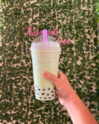 Melon milk tea with tapioca pearls.