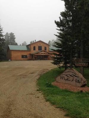 Front of lodge on a misty summer morning