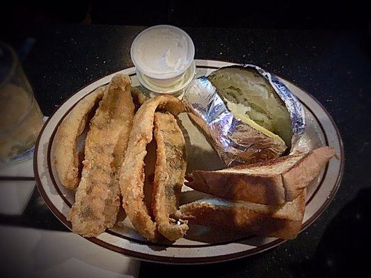 PERCH DINNER: A half-pound of hand breaded Zander perch, fried to a golden brown. Served with Texas toast, baked potato, and tartar sauce.