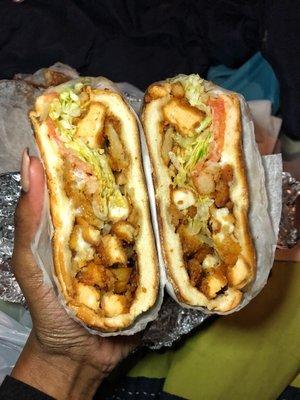 The heartattack (chicken,fries, mozzarella sticks, lettuce & tomatoes) on a roll