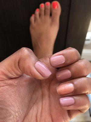 Gel mani (different color on ring finger) and bright pedi in the background