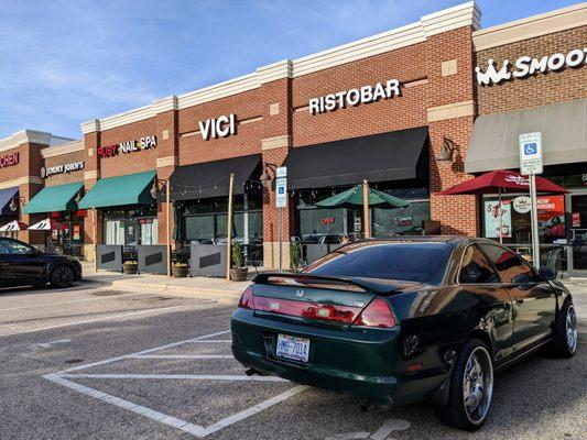 Outside. Storefront and patio. Located in the Hope Valley Commons shopping center.