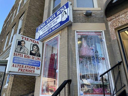 Store Front. Go into the shop and walk all the way back to speak to the tailors.