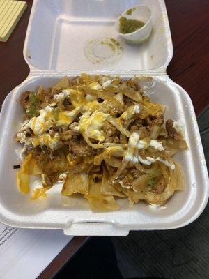 Nachos; home made chips, pork, onions, sour cream and cheese. So so good.