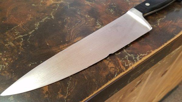 Does this look like your favorite knife?  Don't throw that knife away, we can put an edge on it, if the nick isn't too deep.