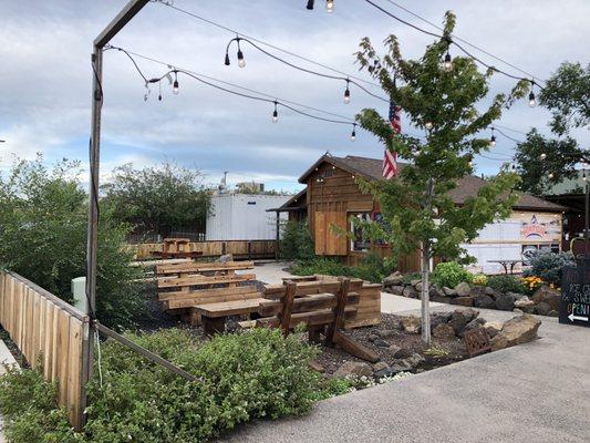 Front yard seating for the Red Barn Creamery, which is the building. Additional seating in the backyard.