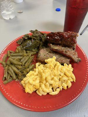 Meatloaf with green beans, collard greens with cornbread , and macaroni and cheese.