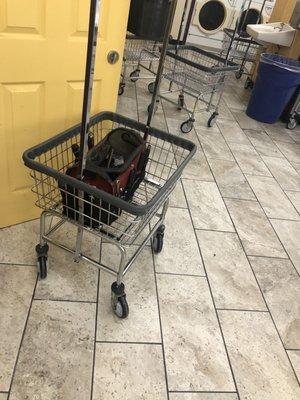 Laundry cart for customers filled with dirty tools.