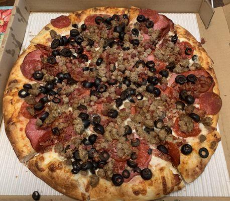 All meat minus salami and added olives.  Best pizza in area!