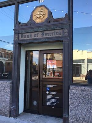 The front of B of A Bank on Pacific Ave. Love the old English Lettering for the name of the bank and the engraved gold ship.