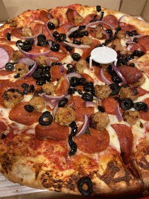 Pepperoni, sausage, black olives, & red onions on their original thick crust... Delicious.