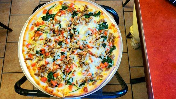 My usual - Mediterranean pizza, hold the feta, add ground Italian sausage.