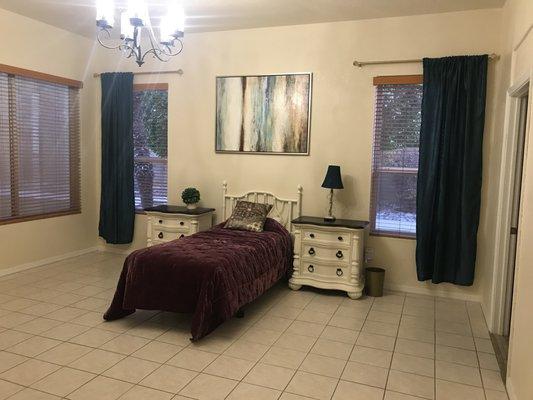 Master bedroom with private bath and entry to outside courtyard.