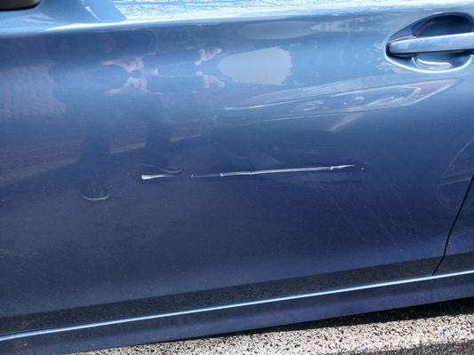 scratch only...no dent...also two small scratches on protruding ede above.