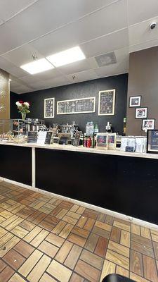 Bar area with menu and pastries.