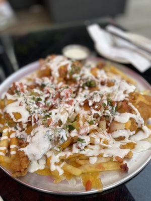 Fully Loaded Chicken Tender Fries (fries topped with melted cheeses, our crispy chicken tenders, crumbled bacon, jalapenos pico de gallo)