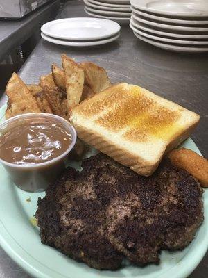 Chop steak with fries , mushroom gravy on the side