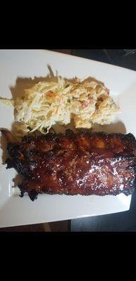 Wow! What a super amazingly tender baby back rib. Paired with cole slaw and potato salad