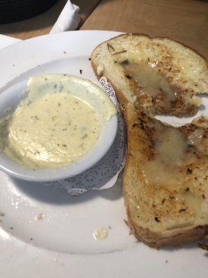 Cheesy Bread with sauce. (1) of four slices of gigantic bread.