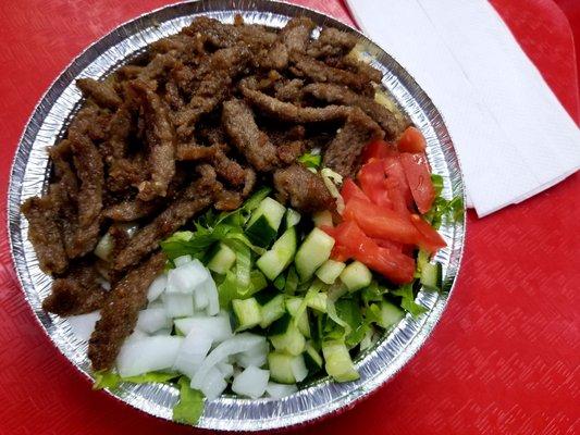 Gyro salad with rice at the bottom.