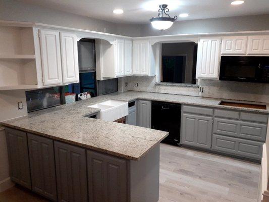 New countertops, flooring, painted cabinets, & new sink