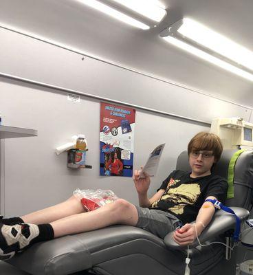 The boy donating.