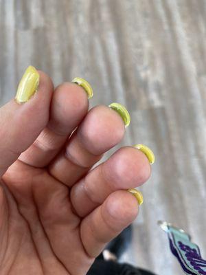 The green still on my nail under the yellow because he didn't want to bother fully removing it...