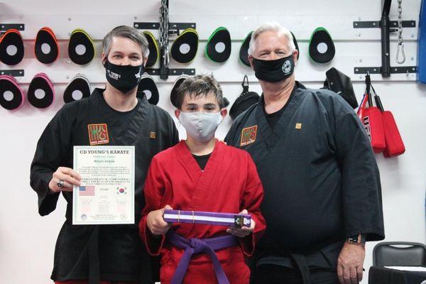 Receiving his 3Purple belt