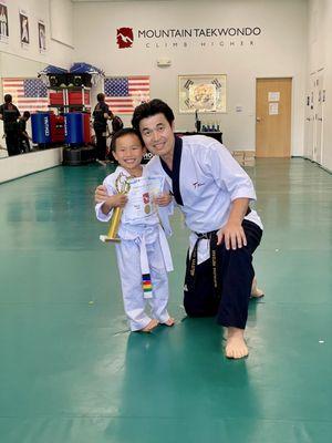 Completing his belt test with Master Mountain