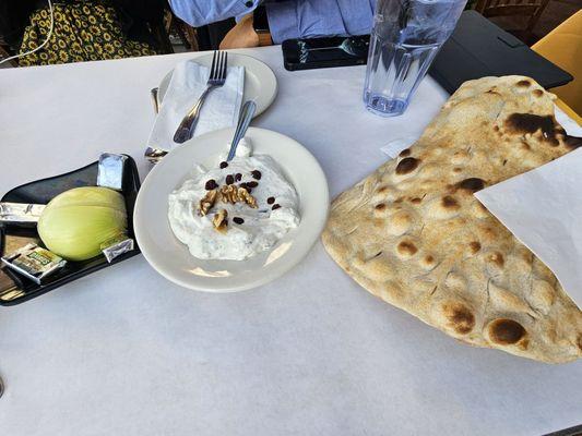 Bread and tzatziki sauce, with an onion!!