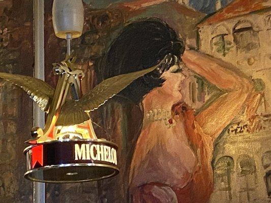 Lady in mural, possibly the actual waitress 45 years ago?   Also, supercooL Michelob light.   OhmyGoddess! ultra low cleavage¿