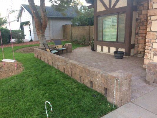 Front pavers and wall design to create a front patio that didn't previously exist.