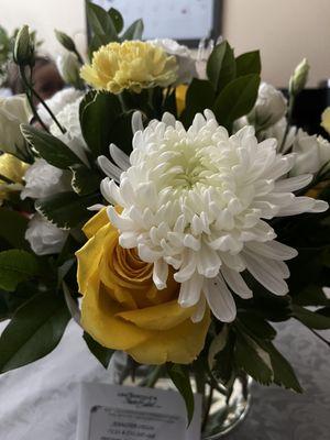 Yellow roses, white mums, yellow carnations, green foliage