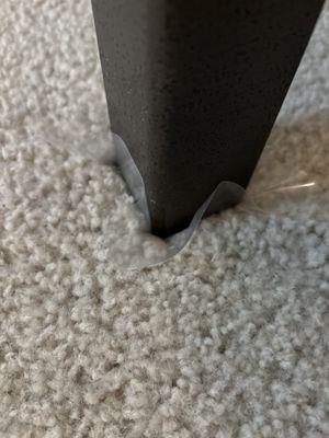 Little plastic squares under every table and chair leg