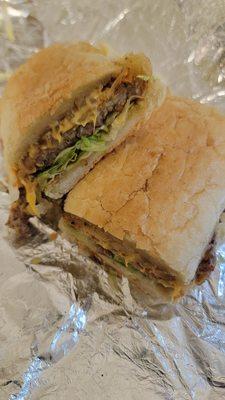 Poboy. Is it steakum? Scrapple? Burger patty? If you find out, lemme know, will ya???