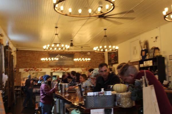 Bar area filled with busy happy customers