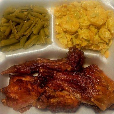 Smoked turkey wing dinner with green beans and seafood salad.