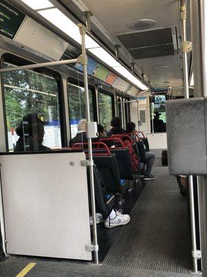 Diverse mix of airport employees, students, and locals going downtown.